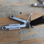 Ersatzteile Suzuki GSF1200N-S WVA9 Sozius-Fussrastentraeger rear footpeg assy Ersatzteile Suzuki GSF1200N-S WVA9 Sozius-Fussrastentraeger rear footpeg assy 43700 32F00 GSF1200N S WVA9 Sozius Fussrastentraeger rear footpeg assy 2